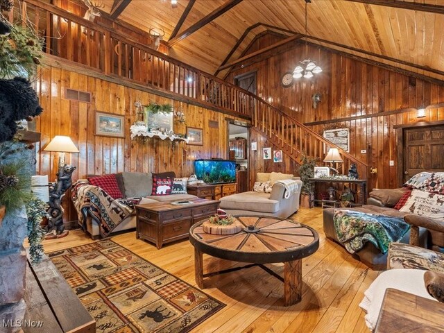 10664 W Little Kanawha Hwy, Mount Zion, WV 26151 - living area featuring wood ceiling, wood walls, stairway, high vaulted ceiling, and wood-type flooring