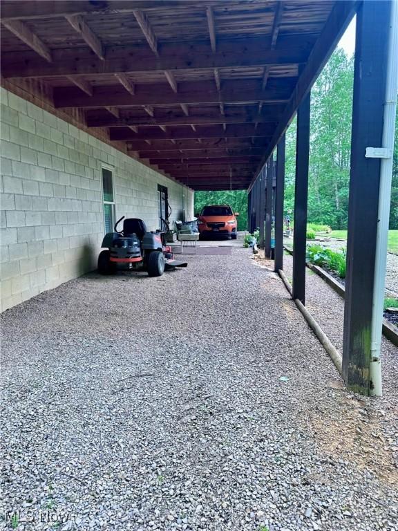 10664 W Little Kanawha Hwy, Mount Zion, WV 26151 - view of vehicle parking featuring an attached carport