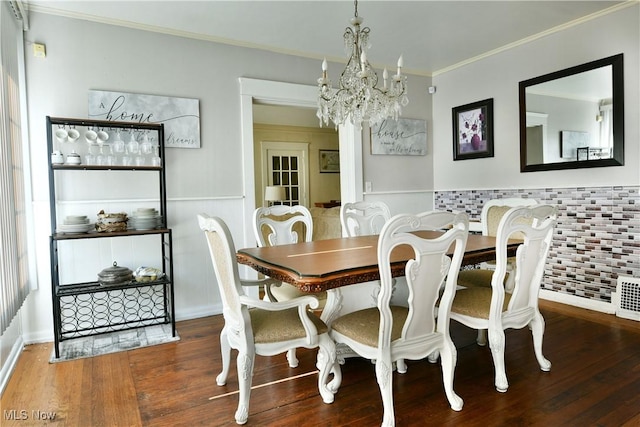 2816 E Market St, Warren, OH 44483 - dining space featuring a chandelier, ornamental molding, wainscoting, and wood finished floors