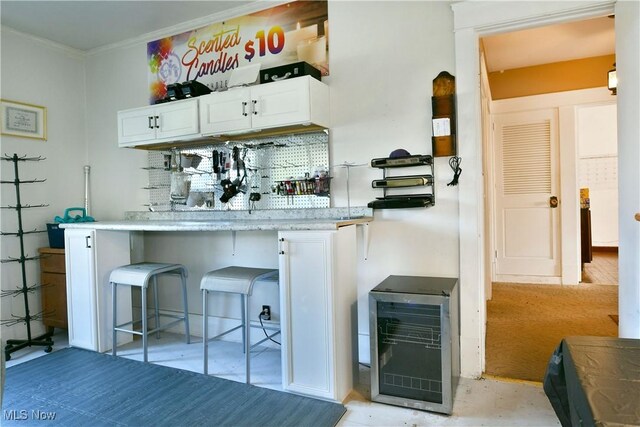 2816 E Market St, Warren, OH 44483 - bar featuring wine cooler and ornamental molding
