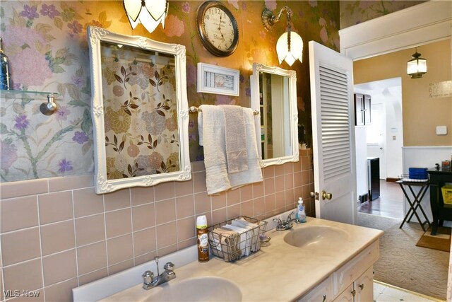 2816 E Market St, Warren, OH 44483 - bathroom with wallpapered walls, double vanity, and a shower
