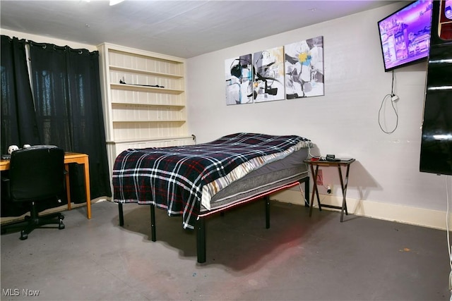 2816 E Market St, Warren, OH 44483 - bedroom featuring finished concrete flooring and baseboards