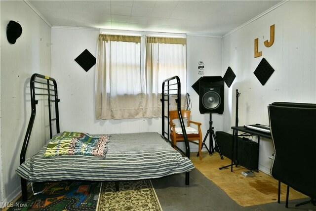 2816 E Market St, Warren, OH 44483 - bedroom with ornamental molding and finished concrete flooring