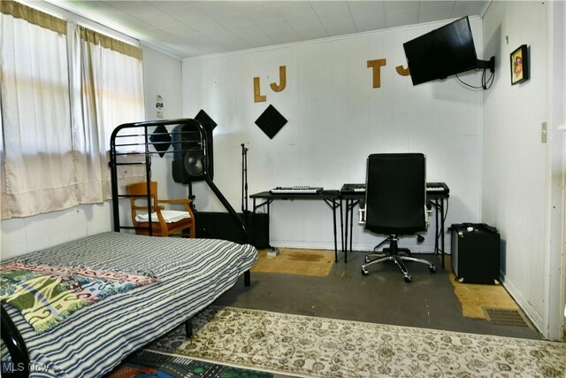 2816 E Market St, Warren, OH 44483 - bedroom with ornamental molding, concrete flooring, and a desk