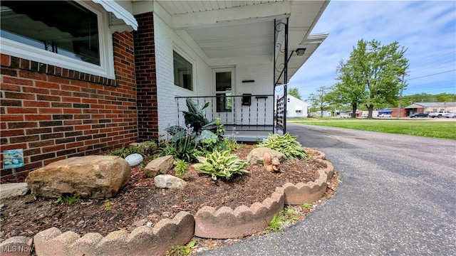 3205 State Rd, Ashtabula, OH 44004 - view of property exterior with brick siding and a porch