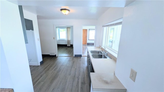 3205 State Rd, Ashtabula, OH 44004 - corridor featuring a sink, light wood-type flooring, and baseboards
