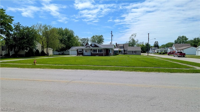3205 State Rd, Ashtabula, OH 44004 - view of front of property featuring a front lawn, an attached garage, driveway, and a residential view