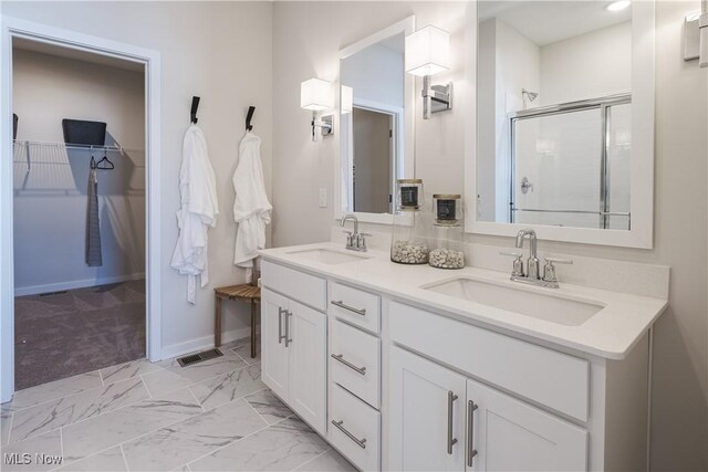 4367 Main St, Perry, OH 44081 - bathroom with a stall shower, a spacious closet, double vanity, baseboards, and marble finish floors