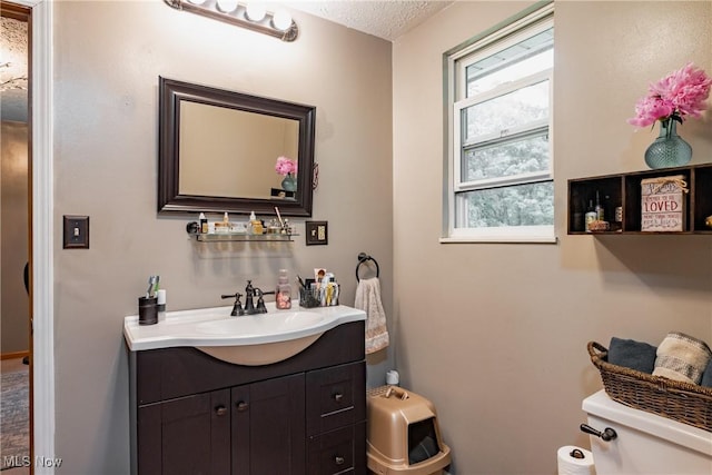2993 Harris Hwy, Washington, WV 26181 - half bath with toilet, vanity, and a textured ceiling