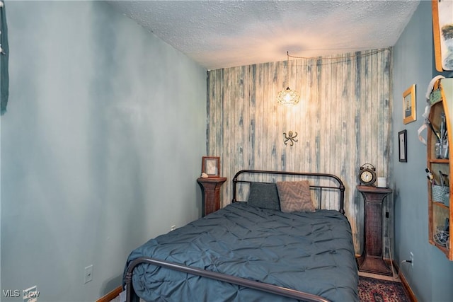 2993 Harris Hwy, Washington, WV 26181 - bedroom with a textured ceiling and baseboards