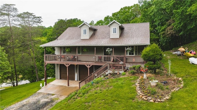 2993 Harris Hwy, Washington, WV 26181 - view of front facade with driveway, a porch, a front yard, an attached garage, and roof with shingles