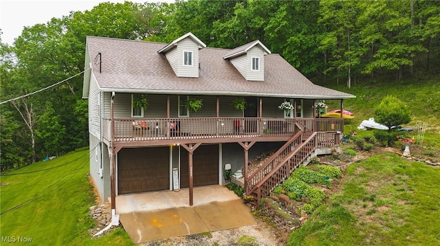 2993 Harris Hwy, Washington, WV 26181 - view of front of house with a front lawn, an attached garage, driveway, a porch, and a shingled roof