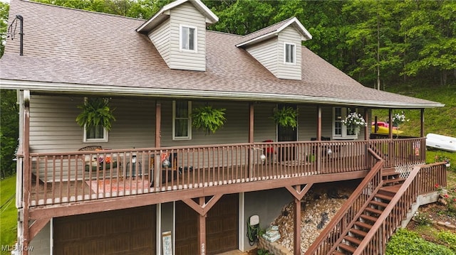 2993 Harris Hwy, Washington, WV 26181 - view of front of house with roof with shingles, an attached garage, covered porch, and stairway