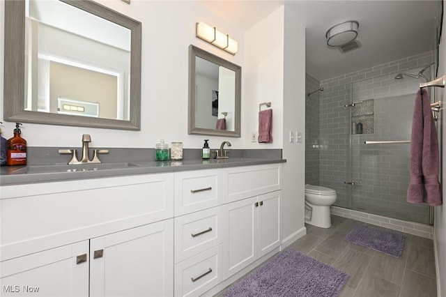 947 Trimble Pl, Sagamore Hills, OH 44067 - full bath featuring toilet, a stall shower, and double vanity