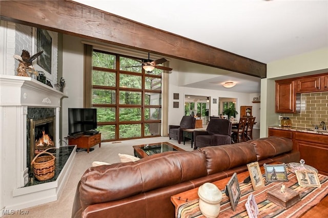 947 Trimble Pl, Sagamore Hills, OH 44067 - living room with a fireplace, carpet flooring, and a ceiling fan