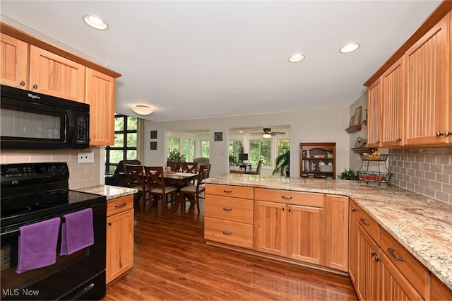 947 Trimble Pl, Sagamore Hills, OH 44067 - kitchen with black appliances, a peninsula, backsplash, dark wood-style flooring, and recessed lighting