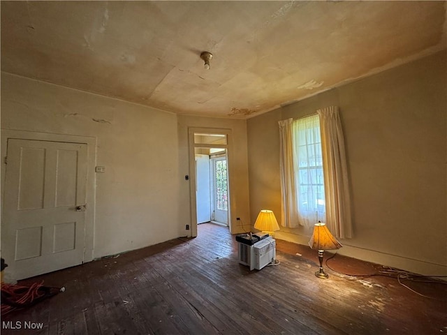 202 E Spring St, Bethesda, OH 43719 - empty room with dark wood finished floors and baseboards