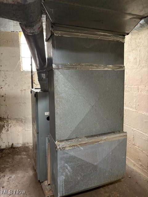 639 Bellevue Ave, Akron, OH 44307 - basement view of concrete floors and heating unit