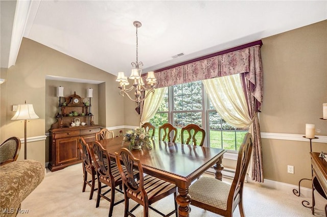 29 Amber Way, Norwalk, OH 44857 - dining area with light colored carpet, a chandelier, vaulted ceiling, and baseboards