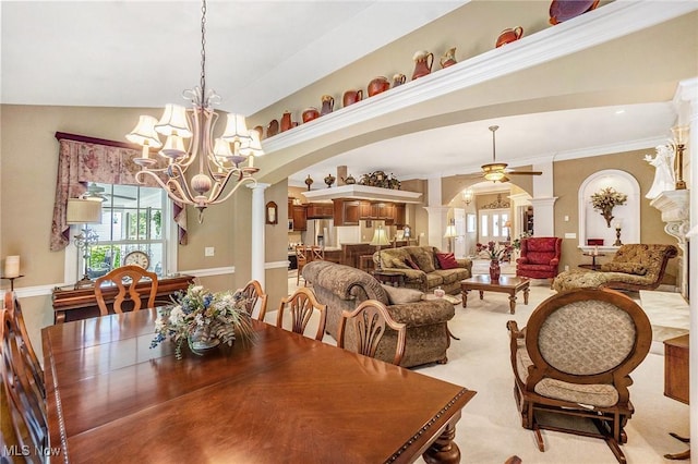 29 Amber Way, Norwalk, OH 44857 - dining area with ornate columns, a chandelier, arched walkways, and a ceiling fan