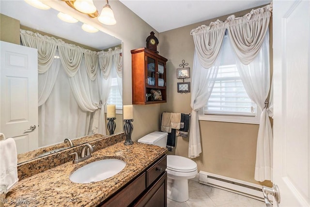 29 Amber Way, Norwalk, OH 44857 - bathroom featuring baseboard heating, toilet, vanity, and baseboards