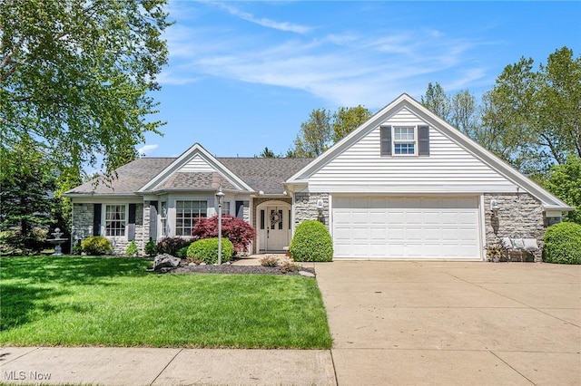 29 Amber Way, Norwalk, OH 44857 - view of front of property featuring stone siding, driveway, a front lawn, and an attached garage