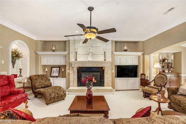 29 Amber Way, Norwalk, OH 44857 - living room with ceiling fan, ornamental molding, carpet floors, a premium fireplace, and arched walkways