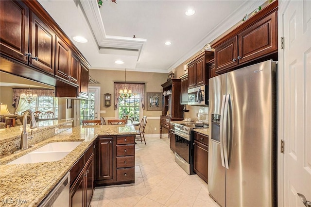 29 Amber Way, Norwalk, OH 44857 - kitchen with stainless steel appliances, a sink, a chandelier, decorative light fixtures, and ornamental molding