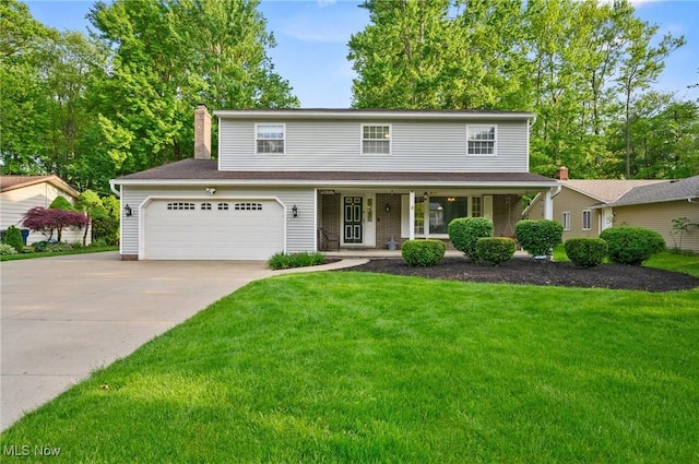 27539 Linwood Cir, North Olmsted, OH 44070 - traditional-style house featuring driveway, a front yard, a porch, and a chimney