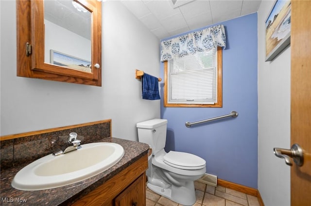 27539 Linwood Cir, North Olmsted, OH 44070 - bathroom with toilet, vanity, and baseboards