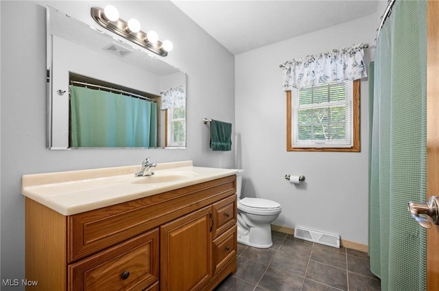 27539 Linwood Cir, North Olmsted, OH 44070 - full bath with toilet, baseboards, vanity, and tile patterned floors