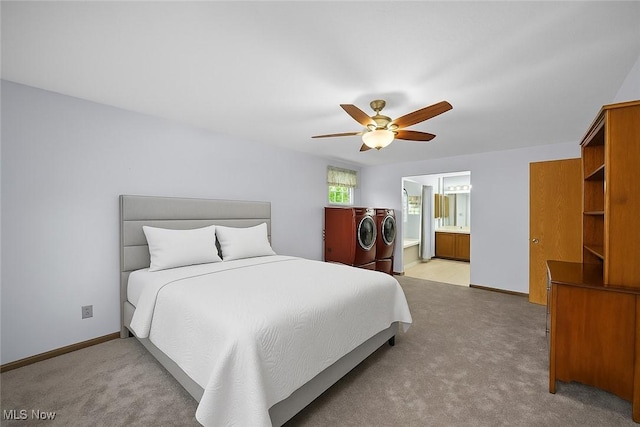 27539 Linwood Cir, North Olmsted, OH 44070 - bedroom with washing machine and clothes dryer, light colored carpet, baseboards, connected bathroom, and a ceiling fan