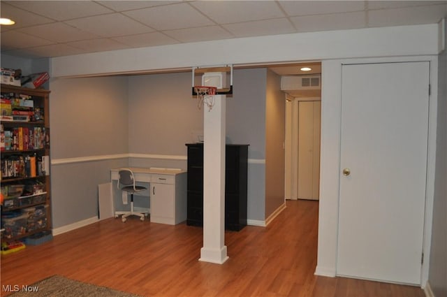 1883 Ridge Meadow Ct, Twinsburg, OH 44087 - finished basement with wood finished floors, baseboards, a drop ceiling, and recessed lighting