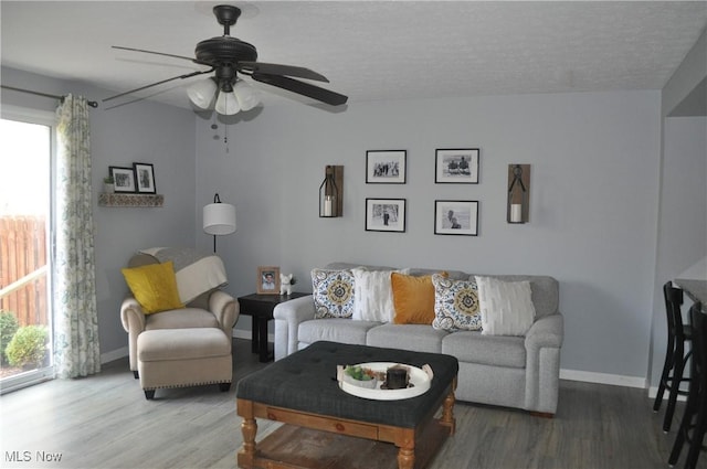 1883 Ridge Meadow Ct, Twinsburg, OH 44087 - living area with wood finished floors, healthy amount of natural light, and ceiling fan