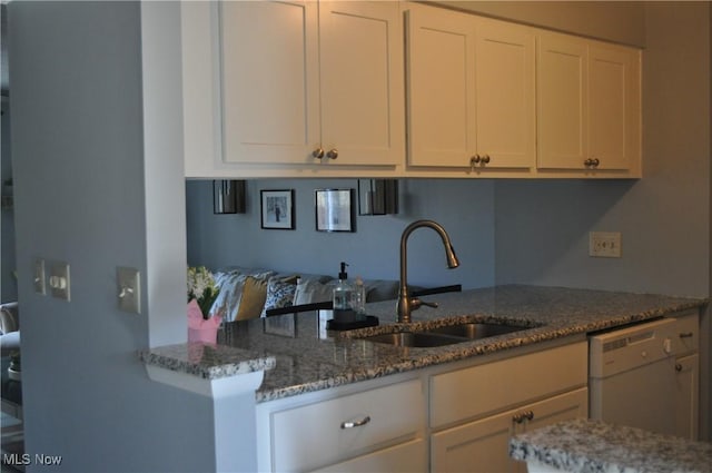 1883 Ridge Meadow Ct, Twinsburg, OH 44087 - kitchen featuring a sink, stone countertops, white dishwasher, and white cabinetry