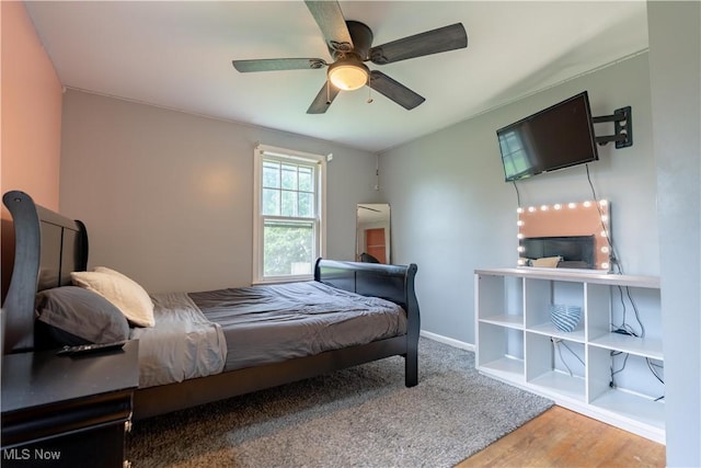 3796 Sweitzer St NW, Uniontown, OH 44685 - bedroom featuring wood finished floors, baseboards, and ceiling fan