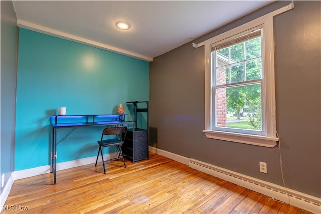 3796 Sweitzer St NW, Uniontown, OH 44685 - home office featuring baseboard heating, baseboards, hardwood / wood-style floors, and recessed lighting