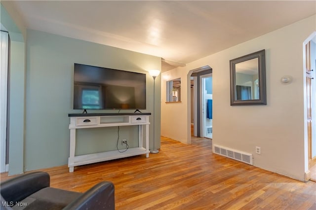 3796 Sweitzer St NW, Uniontown, OH 44685 - living room with wood finished floors and arched walkways