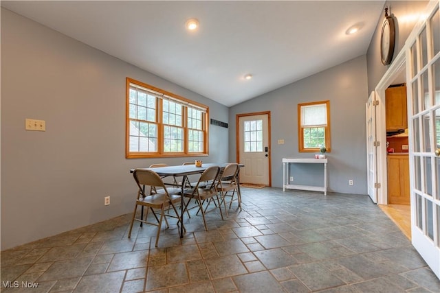 3796 Sweitzer St NW, Uniontown, OH 44685 - dining room with stone tile flooring, vaulted ceiling, and recessed lighting
