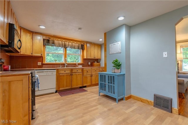 3796 Sweitzer St NW, Uniontown, OH 44685 - kitchen with dishwasher, a sink, stainless steel electric range, backsplash, and recessed lighting