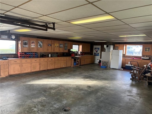 20022 County Road 6, Coshocton, OH 43812 - garage with freestanding refrigerator and wood walls