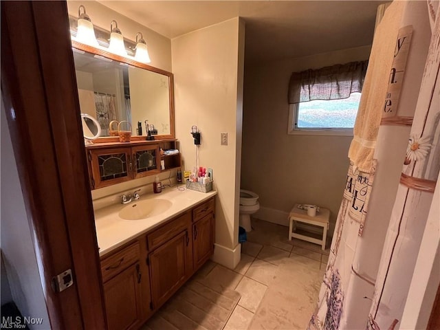 20022 County Road 6, Coshocton, OH 43812 - bathroom with toilet, vanity, and tile patterned flooring