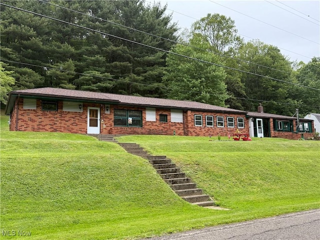 20022 County Road 6, Coshocton, OH 43812 - single story home featuring brick siding, a front yard, and a chimney