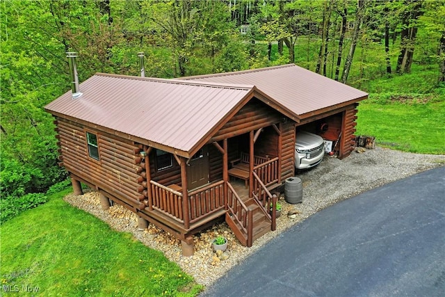 18102 Owen Rd, Middlefield, OH 44062 - log home with log exterior, a porch, a forest view, and metal roof