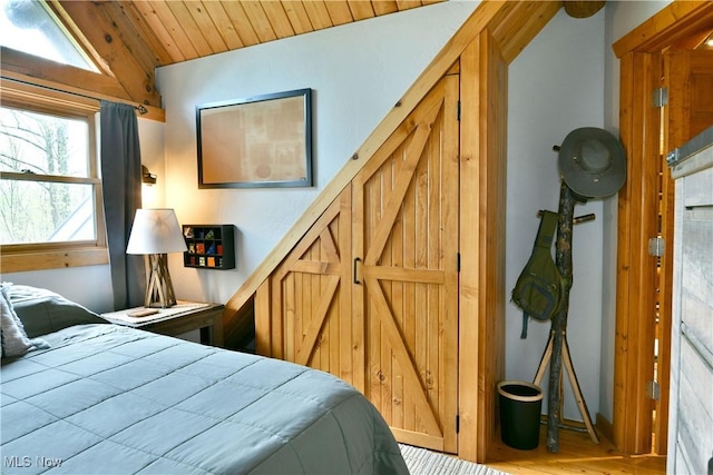 18102 Owen Rd, Middlefield, OH 44062 - bedroom with wooden ceiling and wood finished floors