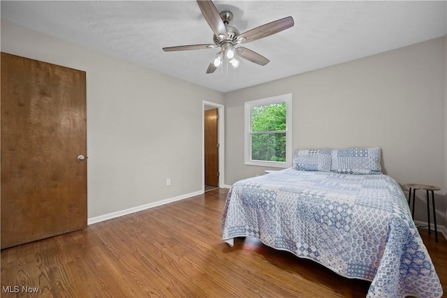 1704 Emerald Dr, Lorain, OH 44053 - bedroom with wood finished floors, baseboards, and a ceiling fan