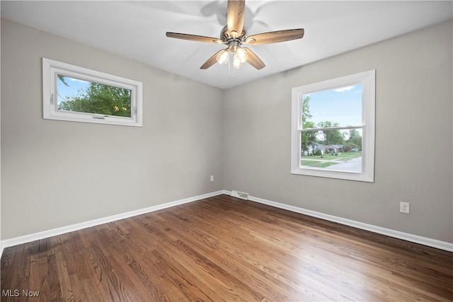 1704 Emerald Dr, Lorain, OH 44053 - empty room featuring baseboards, ceiling fan, and wood finished floors