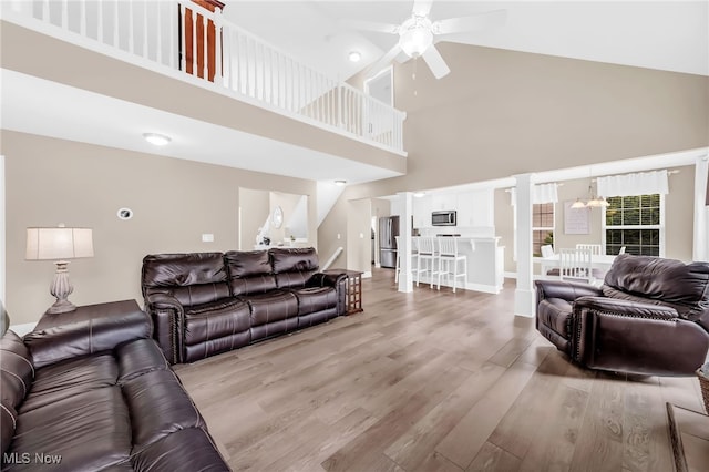 1487 Barrymore Ln, Wadsworth, OH 44281 - living area with a high ceiling, light wood-type flooring, and a ceiling fan