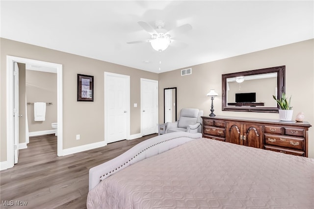 1487 Barrymore Ln, Wadsworth, OH 44281 - bedroom featuring baseboards, wood finished floors, a ceiling fan, and ensuite bathroom