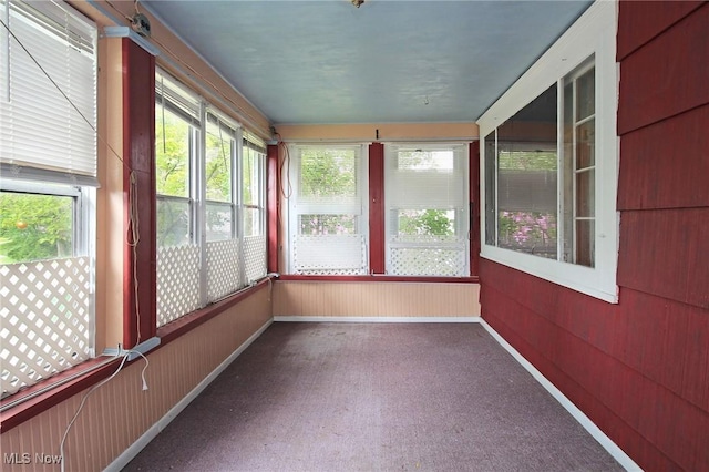 645 N Way St, Barberton, OH 44203 - unfurnished sunroom with carpet and wood walls